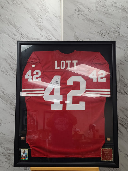 Signed and Framed Hall of Famer Ronnie Lott #42 Jersey – The Signature of a Defensive Legend